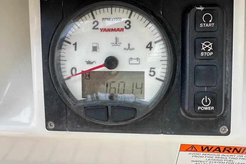 Slide: The Image of Yanmar engine control panel on a 2018 Jeanneau 54 sailboat, showing RPM and warning indicators. - 10