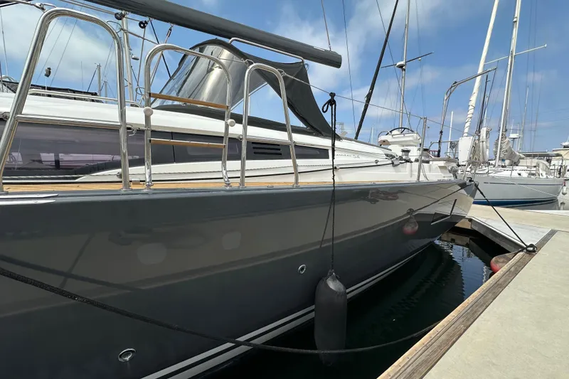 Slide: The Image of 2018 Jeanneau 54 yacht docked at marina, sleek design, sunny day. - 17