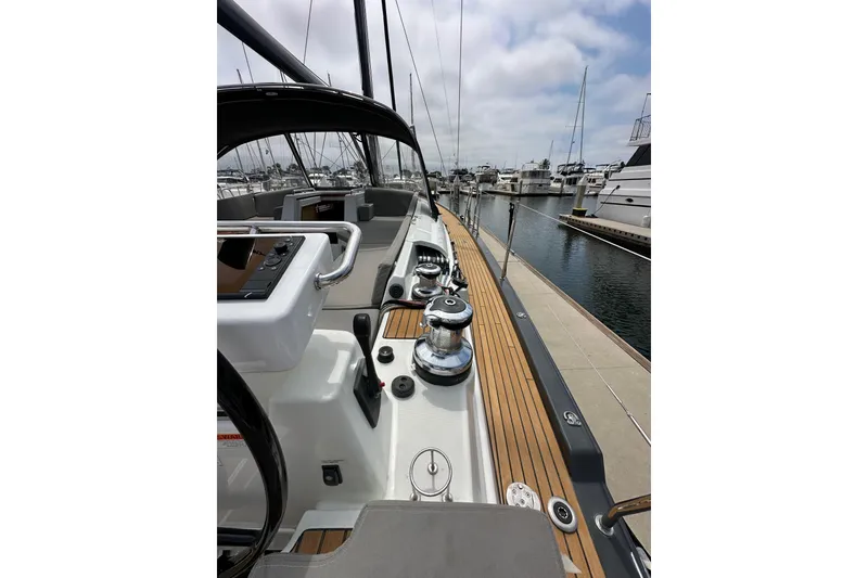 Slide: The Image of 2018 Jeanneau 54 yacht deck with sleek design, docked at marina. - 33