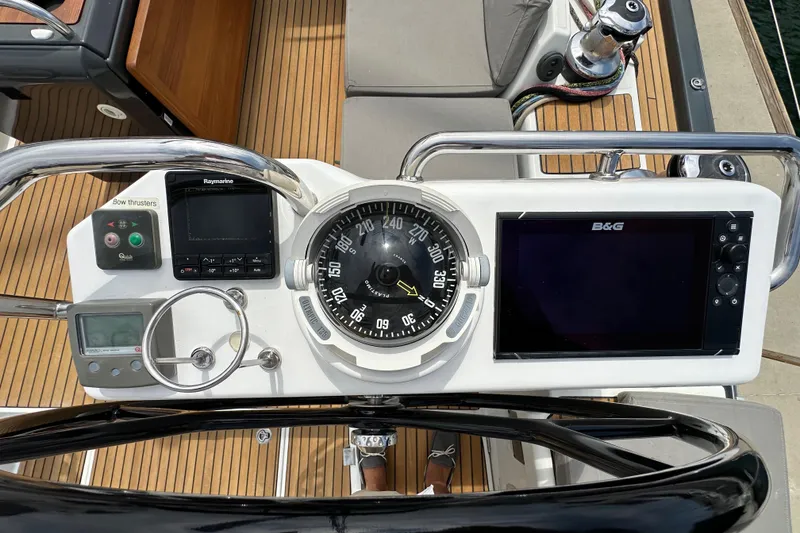 Slide: The Image of Cockpit of 2018 Jeanneau 54 yacht with navigation instruments and compass. - 35
