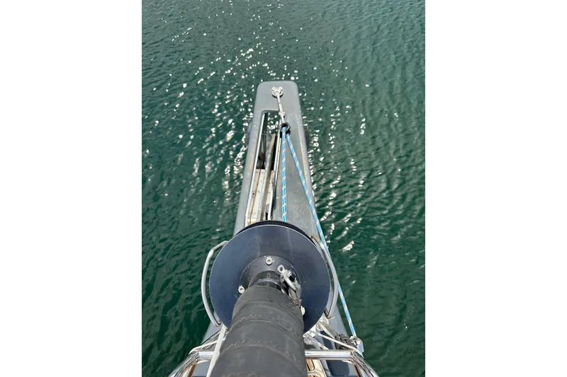 Slide: The Image of 2018 Jeanneau 54 yacht with teak deck, docked in marina under blue sky. - 51