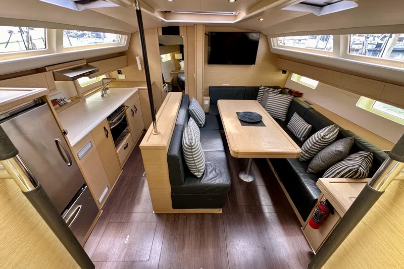 Slide: The Image of Interior of 2018 Jeanneau 54 yacht featuring modern kitchen and dining area. - 63