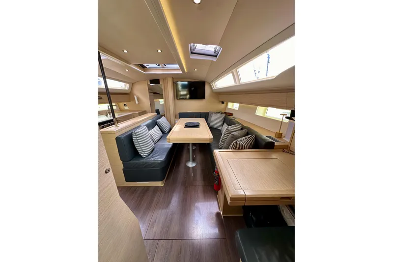 Slide: The Image of Interior of 2018 Jeanneau 54 yacht, featuring modern kitchen and stylish seating area. - 75