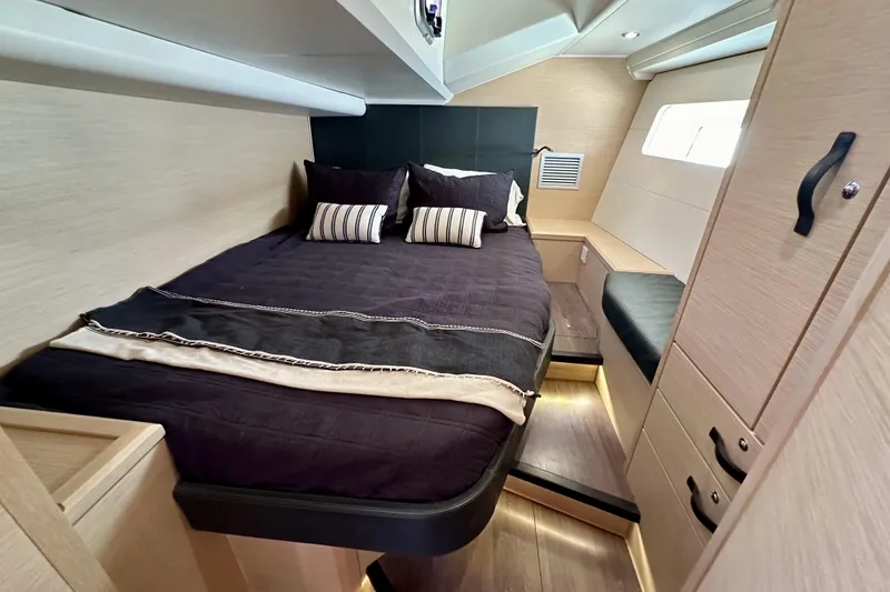 Slide: The Image of Luxurious cabin interior of 2018 Jeanneau 54 yacht with cozy bedding and modern design. - 80