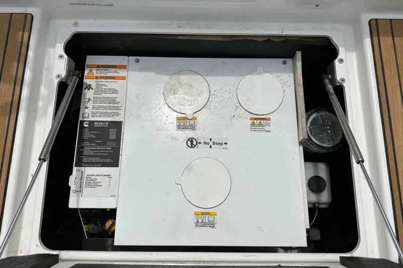 Slide: The Image of Engine compartment of a 2018 Jeanneau 54 sailboat, featuring a generator. - 9