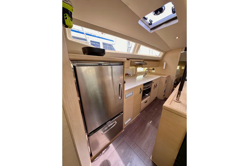 Slide: The Image of Modern kitchen interior of 2018 Jeanneau 54 yacht with sleek cabinetry and appliances. - 91