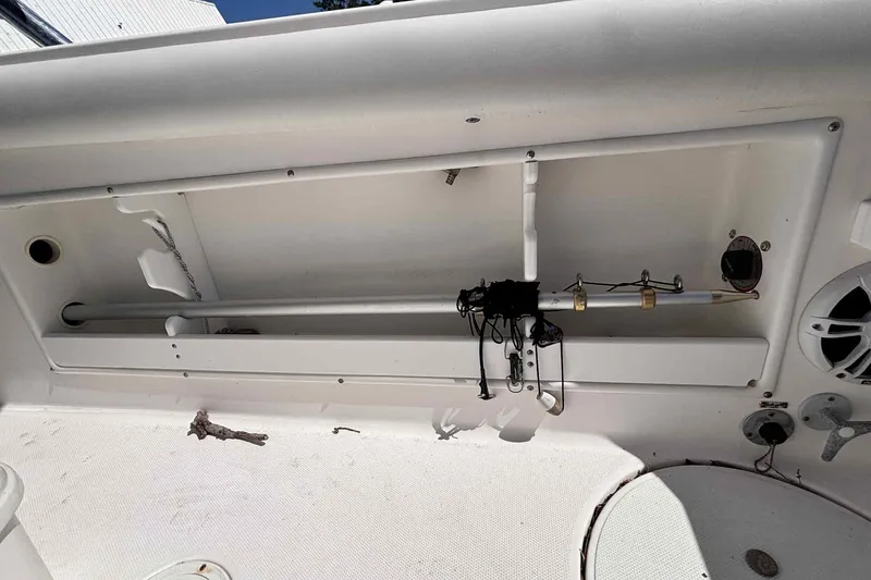 Slide: The Image of Interior view of 1997 Wellcraft 302 Scarab boat with red canopy and control panel. - 9