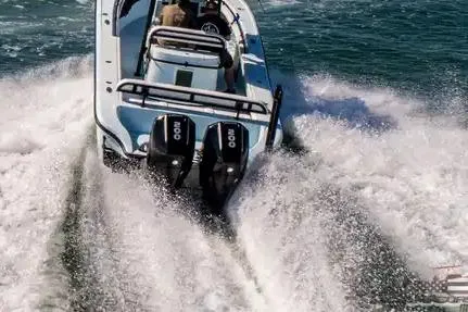 Slide: The Image of 2021 Yellowfin 26 Hybrid boat speeding on water with dual engines. - 16