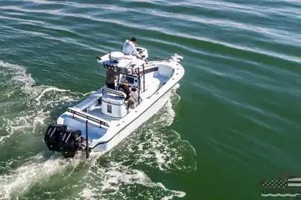 Slide: The Image of 2021 Yellowfin 26 Hybrid boat cruising on open water, viewed from above. - 20