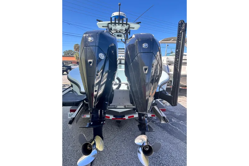 Slide: The Image of 2021 Yellowfin 26 Hybrid boat with dual outboard engines, rear view. - 28