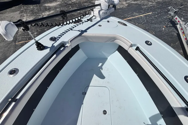 Slide: The Image of 2021 Yellowfin 26 Hybrid boat interior with trolling motor, spacious deck, and storage compartment. - 29