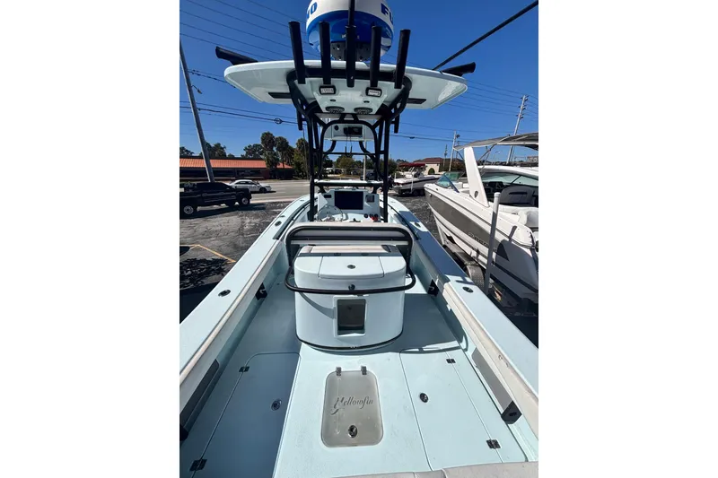 Slide: The Image of 2021 Yellowfin 26 Hybrid boat, spacious deck, modern design, parked at marina. - 35