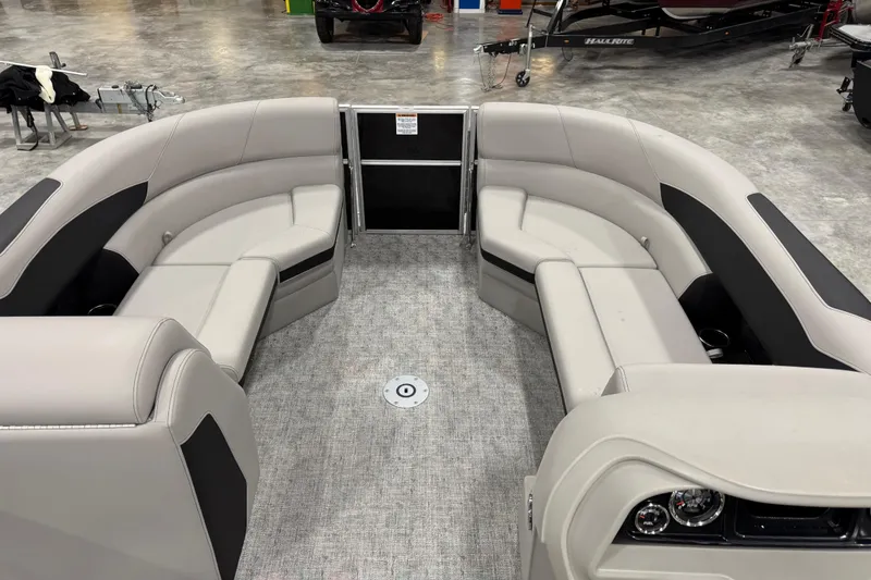 Slide: The Image of 2026 Berkshire 24 UL LE pontoon boat interior with plush seating and modern design. - 15