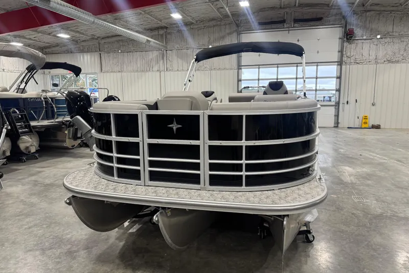 Slide: The Image of 2026 Berkshire 24 UL LE pontoon boat in a showroom, front view. - 5