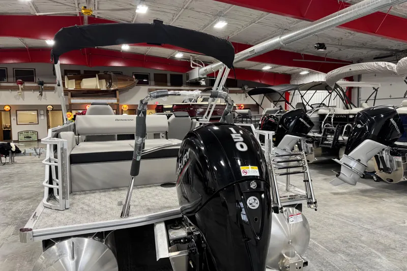 Slide: The Image of 2026 Berkshire 24 UL LE pontoon boat with Mercury 150 engine in showroom. - 6