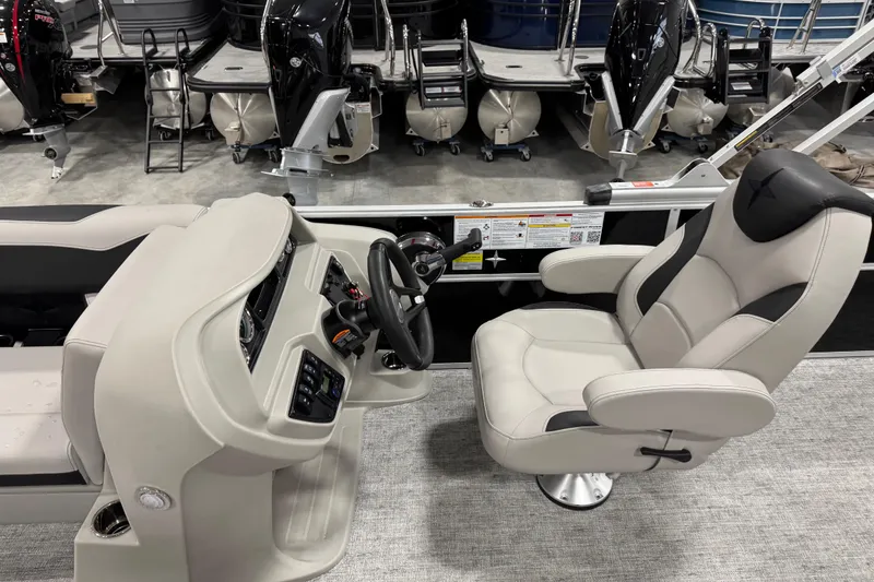 Slide: The Image of Captain's chair and console of 2026 Berkshire 24 UL LE pontoon boat. - 9