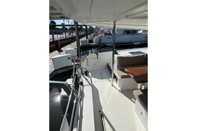 Slide: The Image of 2018 Fountaine Pajot Helia 44 Evolution catamaran docked at marina. - 2