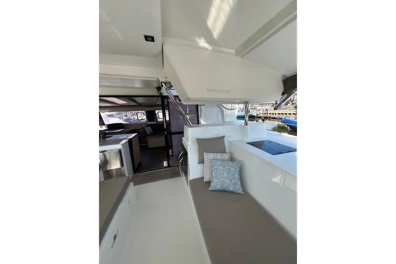 Slide: The Image of 2018 Fountaine Pajot Helia 44 Evolution yacht interior with seating and cushions. - 20