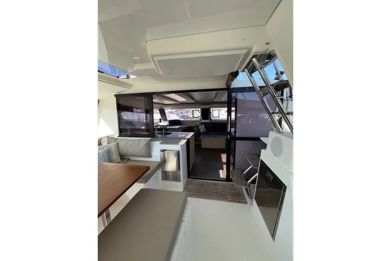 Slide: The Image of Interior of 2018 Fountaine Pajot Helia 44 Evolution catamaran, featuring modern seating and dining area. - 23