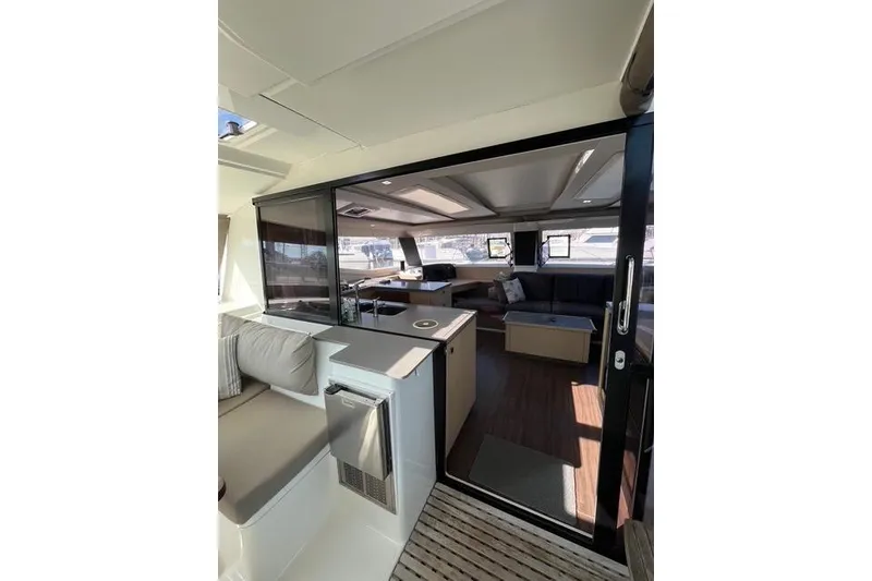 Slide: The Image of Interior of 2018 Fountaine Pajot Helia 44 Evolution catamaran, featuring modern seating and kitchen area. - 24