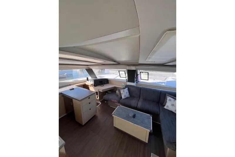 Slide: The Image of Interior of 2018 Fountaine Pajot Helia 44 Evolution catamaran, featuring modern seating and navigation area. - 26