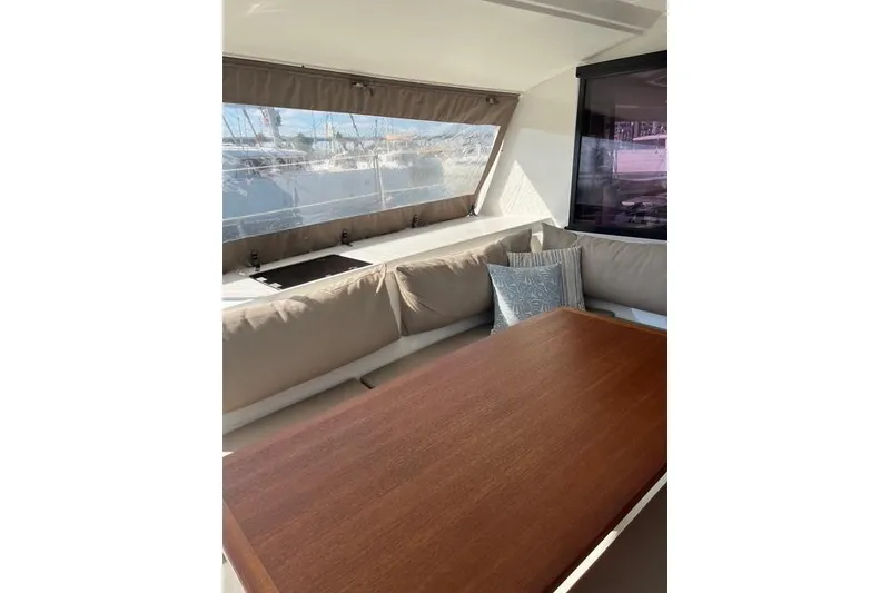 Slide: The Image of Interior of 2018 Fountaine Pajot Helia 44 Evolution catamaran with cozy seating and wooden table. - 28