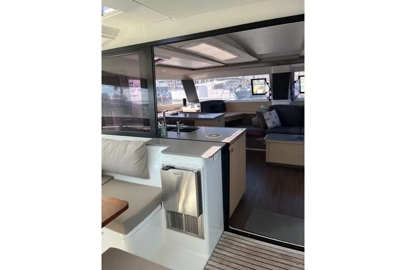 Slide: The Image of Interior view of 2018 Fountaine Pajot Helia 44 Evolution catamaran, featuring modern seating and kitchen area. - 31
