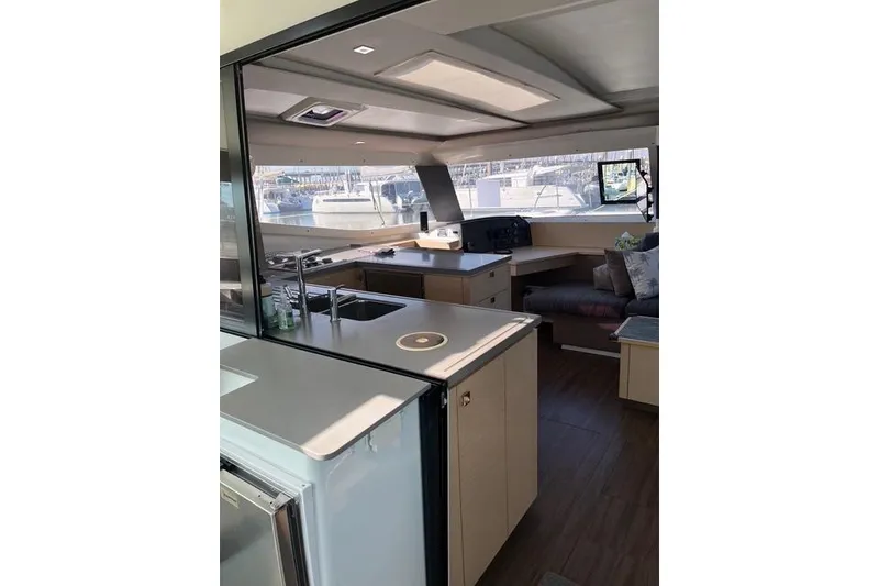 Slide: The Image of Interior of 2018 Fountaine Pajot Helia 44 Evolution catamaran, featuring modern kitchen and seating area. - 32