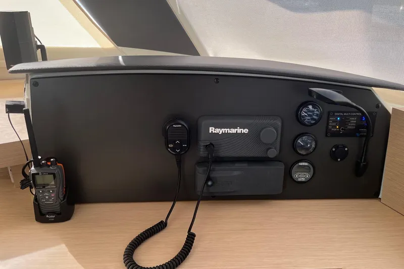 Slide: The Image of Helm of 2018 Fountaine Pajot Helia 44 Evolution catamaran in marina setting. - 4