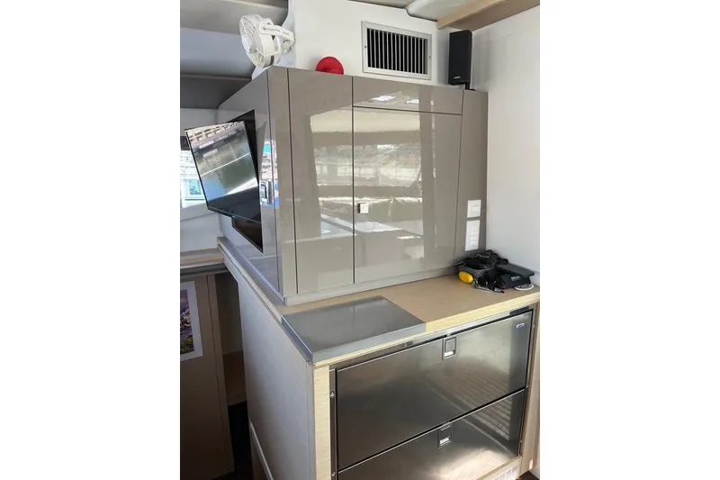 Slide: The Image of Interior of 2018 Fountaine Pajot Helia 44 Evolution yacht, featuring modern cabinetry and appliances. - 40