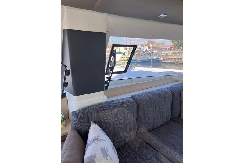 Slide: The Image of Interior view of 2018 Fountaine Pajot Helia 44 Evolution catamaran with striped seating and window. - 46