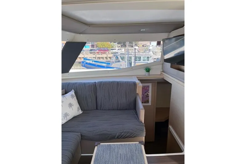 Slide: The Image of Interior of 2018 Fountaine Pajot Helia 44 Evolution yacht with cozy seating and window view. - 48