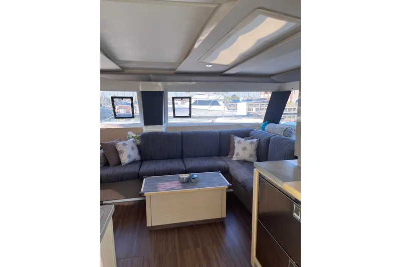 Slide: The Image of 2018 Fountaine Pajot Helia 44 Evolution catamaran docked under clear blue sky. - 6