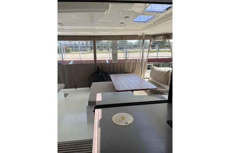 Slide: The Image of 2018 Fountaine Pajot Helia 44 Evolution yacht interior with seating and table. - 60