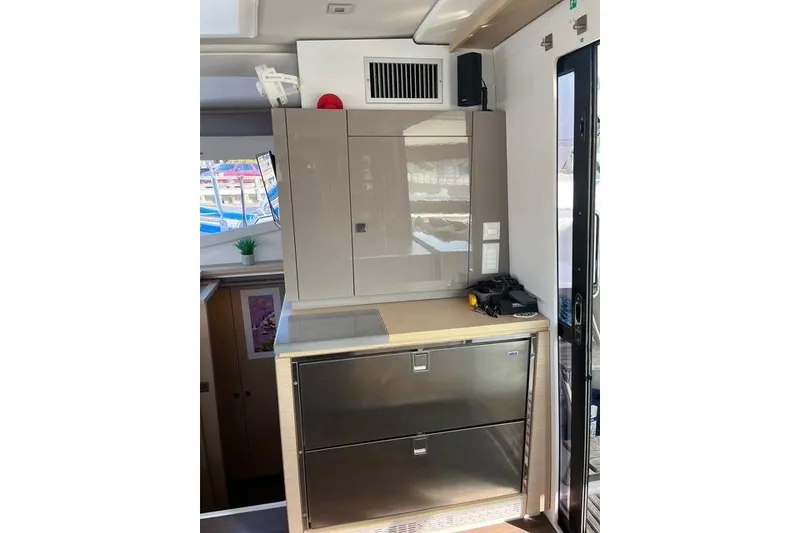 Slide: The Image of Interior of 2018 Fountaine Pajot Helia 44 Evolution yacht, featuring modern cabinetry and appliances. - 62