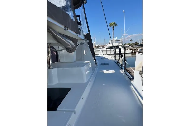 Slide: The Image of 2018 Fountaine Pajot Helia 44 Evolution catamaran deck view at marina. - 70