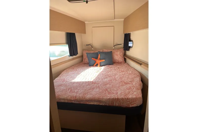 Slide: The Image of 2018 Fountaine Pajot Helia 44 Evolution catamaran with sails, docked under clear blue sky. - 8