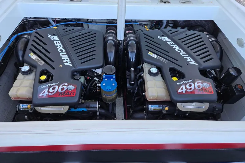Slide: The Image of Twin Mercury MerCruiser 496 MAG engines in a 2003 Baja 33 Outlaw boat. - 13