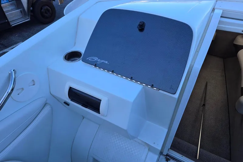 Slide: The Image of 2003 Baja 33 Outlaw boat interior with seating and storage compartment. - 7