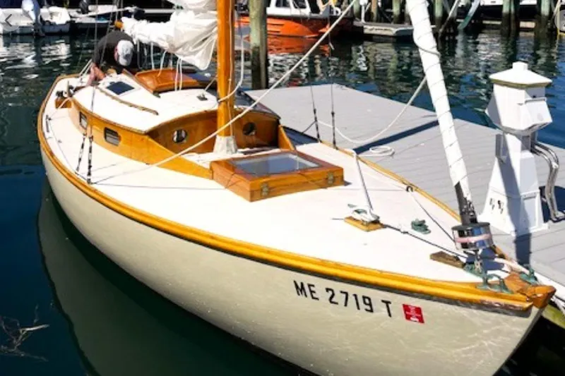 Slide: The Image of Vintage 1950 Mason Ostkust Sloop docked at marina, showcasing classic wooden design. - 4