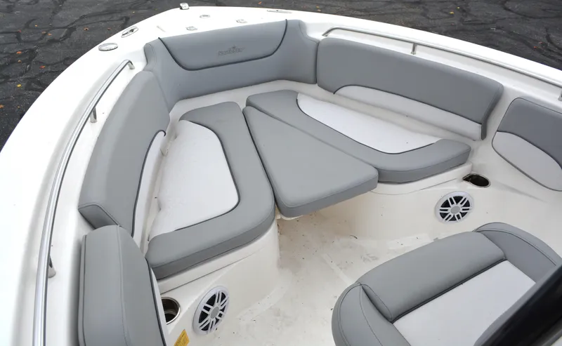 Slide: The Image of 2023 NauticStar 2102 Legacy boat interior with gray cushioned seating. - 11