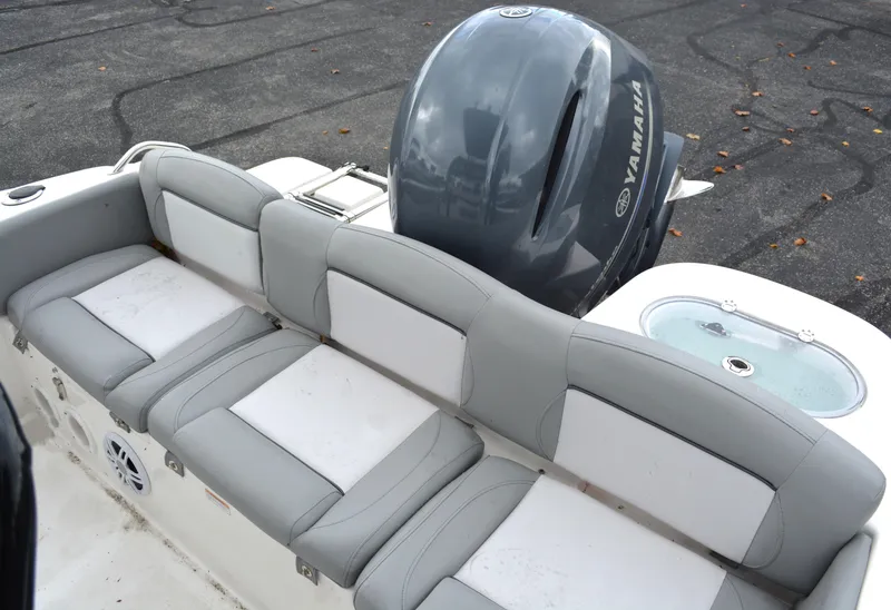 Slide: The Image of 2023 NauticStar 2102 Legacy boat with Yamaha engine and cushioned seating. - 14