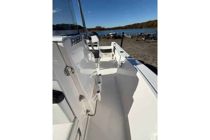 Slide: The Image of 2022 Robalo R180 Center Console boat interior with lake view in the background. - 10