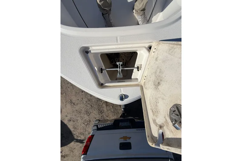Slide: The Image of 2022 Robalo R180 Center Console boat with open anchor compartment. - 6