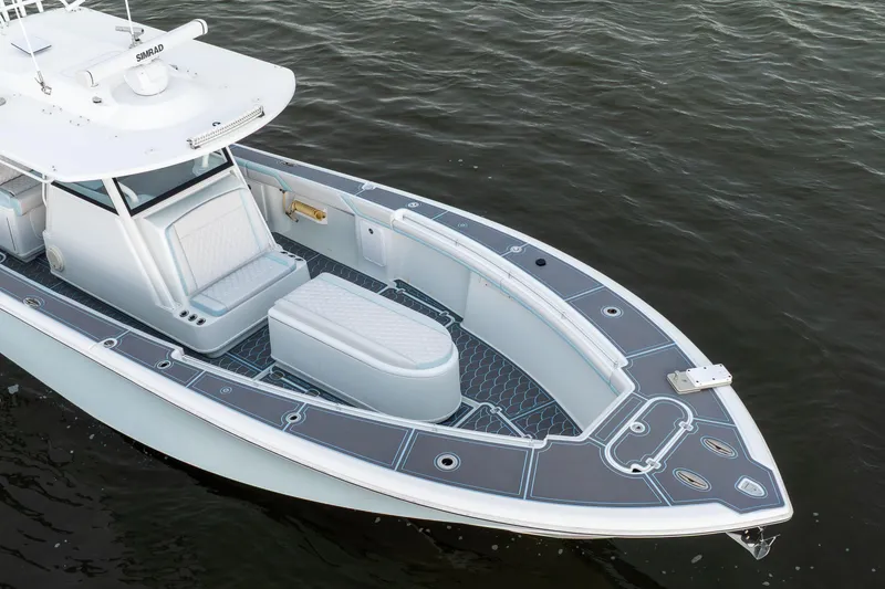 Slide: The Image of 2018 Yellowfin 39 Offshore boat on water, featuring sleek design and spacious deck. - 10