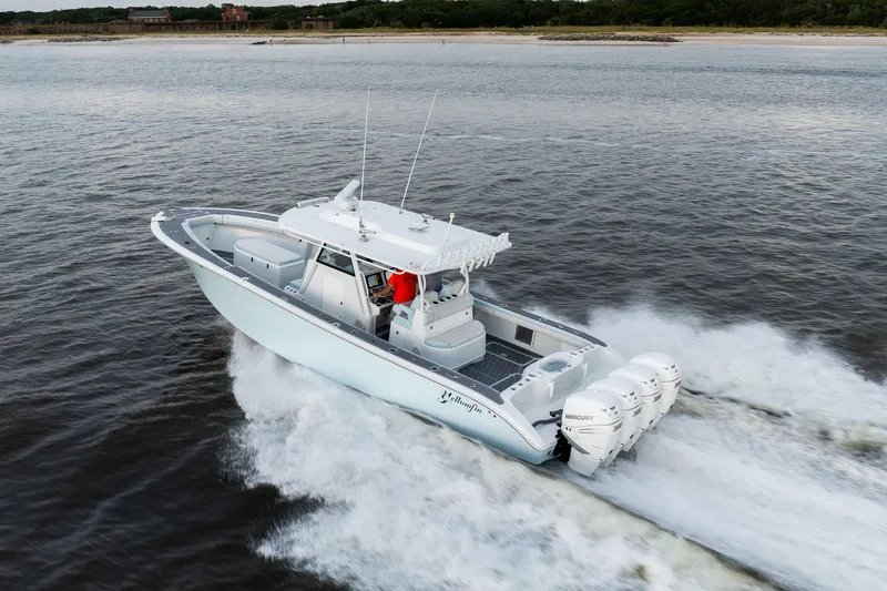 Slide: The Image of 2018 Yellowfin 39 Offshore boat cruising on open water with powerful engines. - 13