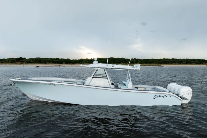 Slide: The Image of 2018 Yellowfin 39 Offshore boat on calm water, side view. - 2
