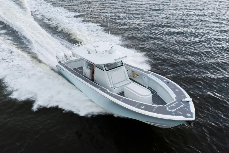 Slide: The Image of 2018 Yellowfin 39 Offshore boat cruising on open water, showcasing sleek design and performance. - 23