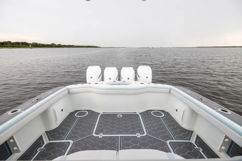 Slide: The Image of 2018 Yellowfin 39 Offshore boat with quad engines on calm water. - 30