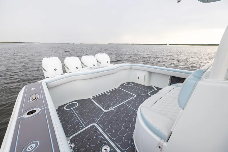 Slide: The Image of 2018 Yellowfin 39 Offshore boat with spacious deck and multiple outboard engines. - 31